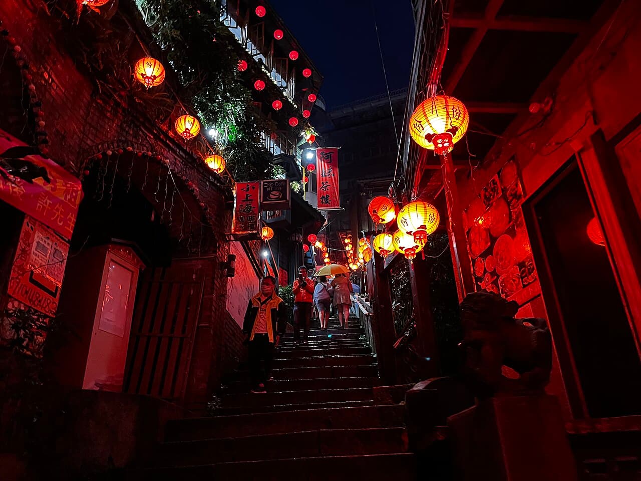 Lantern-lit teahouses glowing after dark in Jiufen.